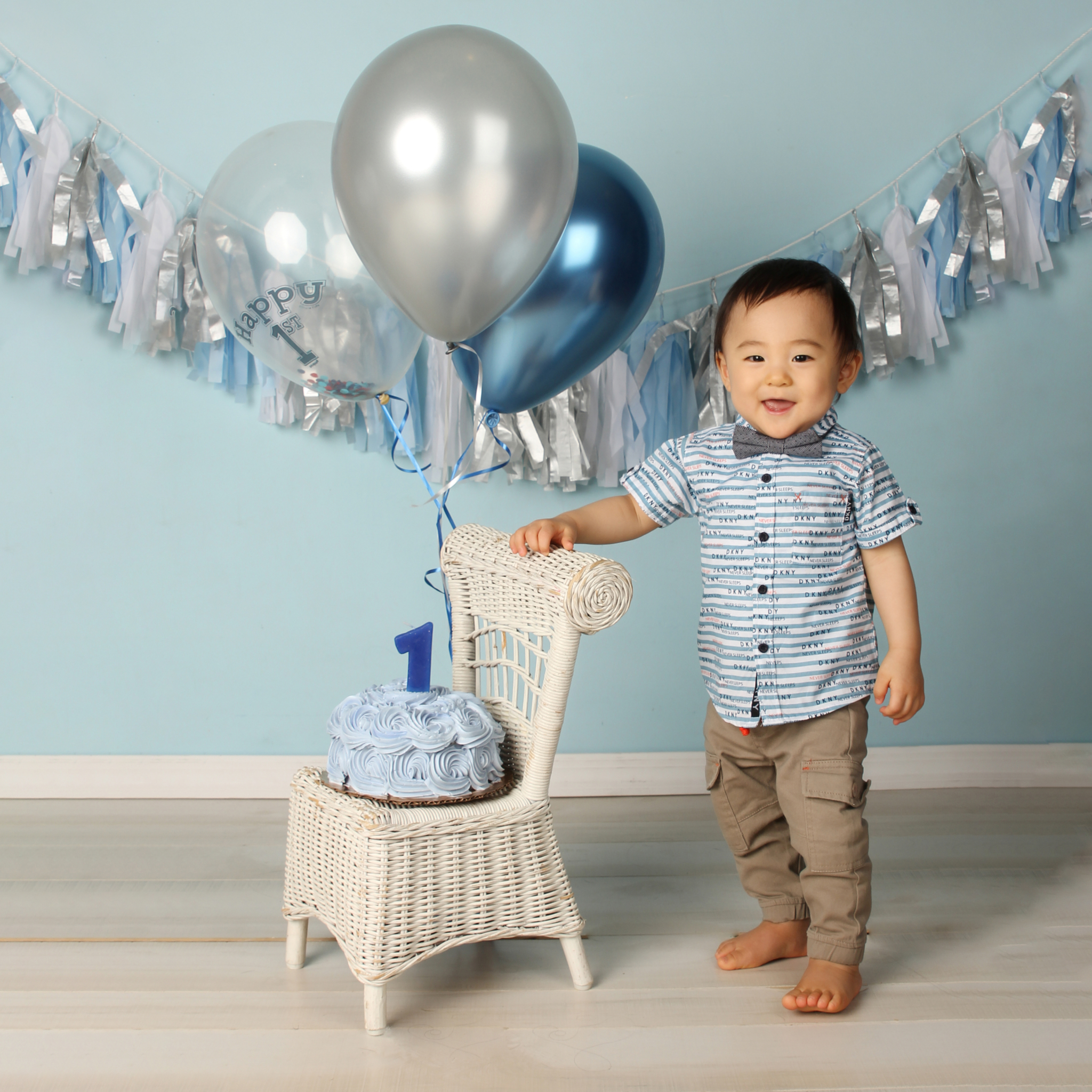 Fringe Banner & BYO Balloons w/White Wicker Chair On Blue