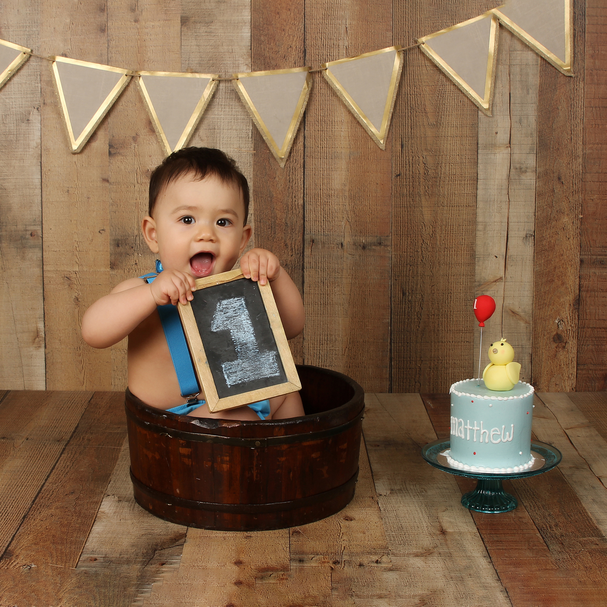 Gold Banner in Wood Bucket on Brown Wood (boy)