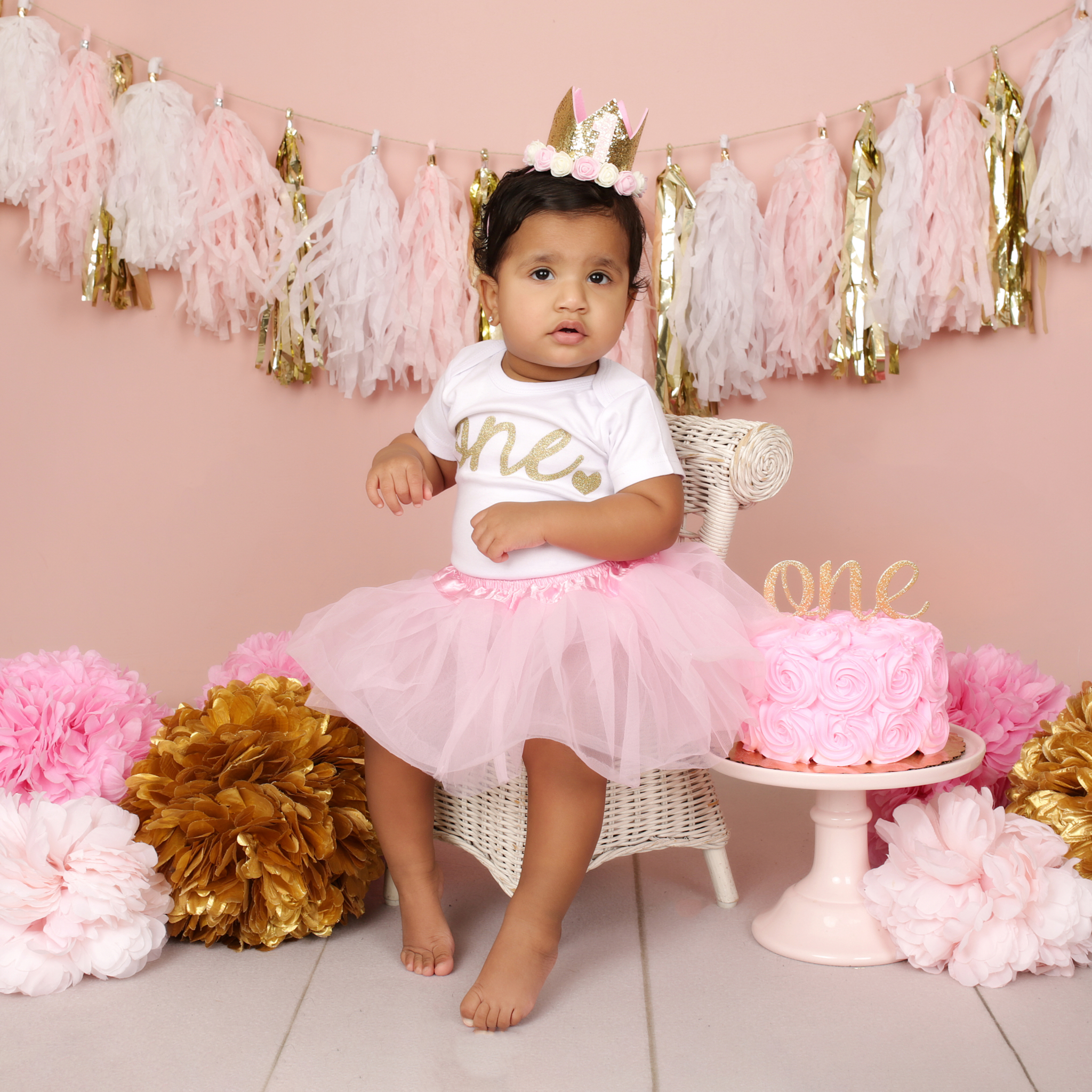 Fringe Banner & Pink & Gold Poofs w/White Wicker Chair On Pink