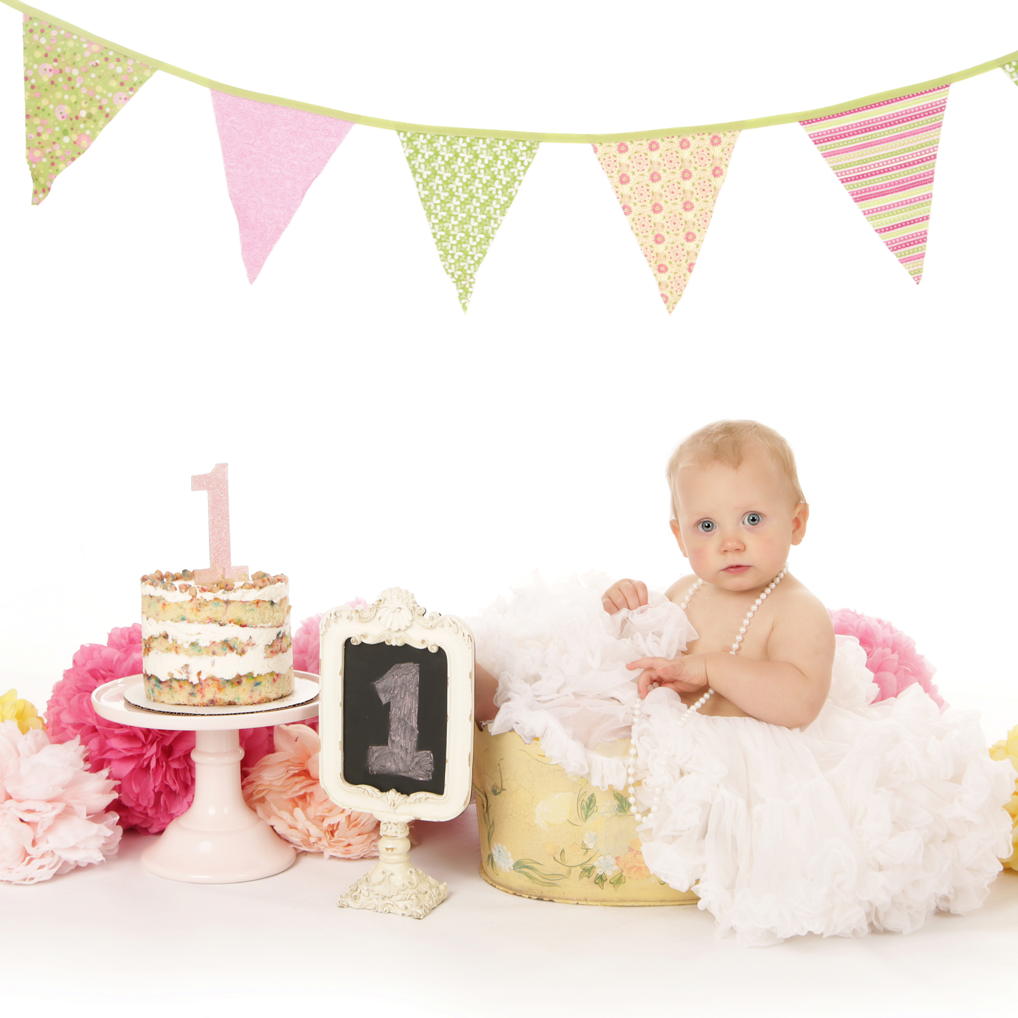 Banner w/Green, Yellow & Pink Poofs in Floral Bucket On White